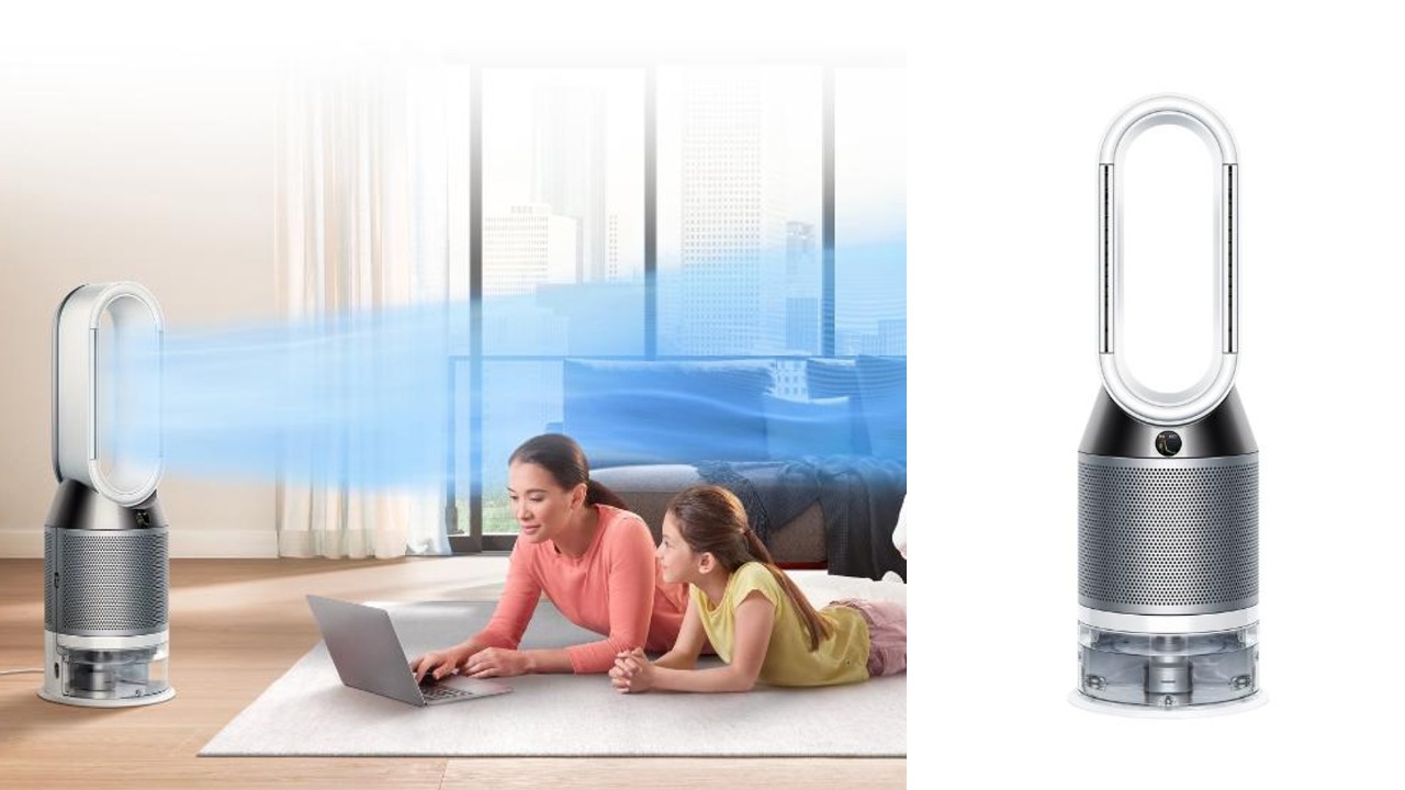 mother and daughter working on laptop while purifier cleans the air around them
