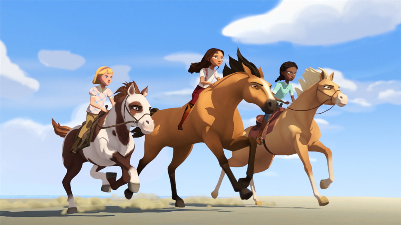 A still from Spirit Riding Free: Ride Along Adventure showing three animated kids riding horses across a desert