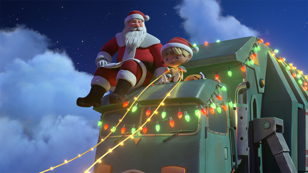 A still from A Trash Truck Christmas showing Santa and a kid riding on a trash truck covered in Christmas lights