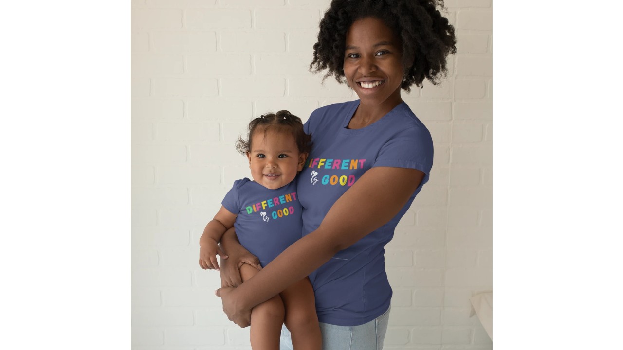 mom and baby wearing matching t-shirt and onesie