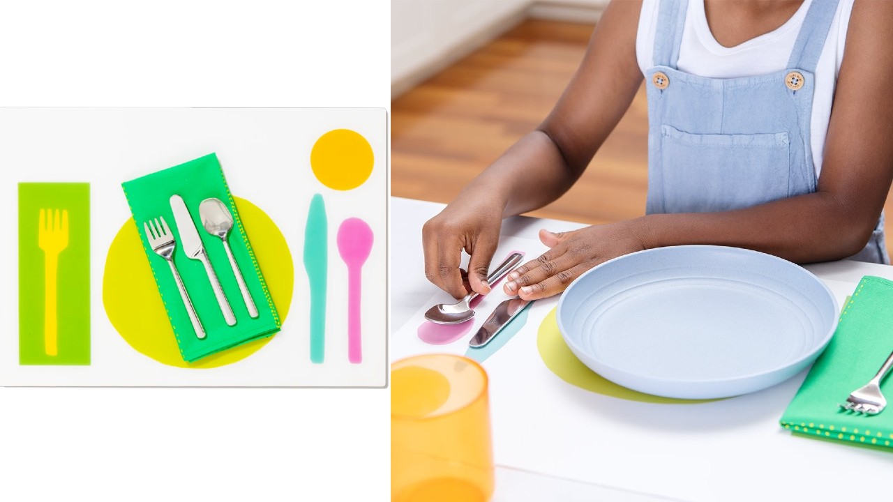 kid setting table with colour-coded placemat