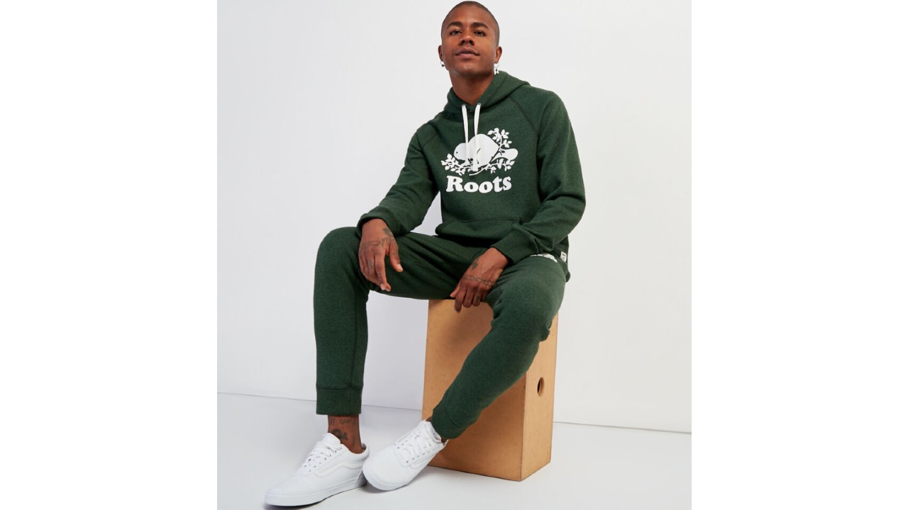 man wearing forest green track suit