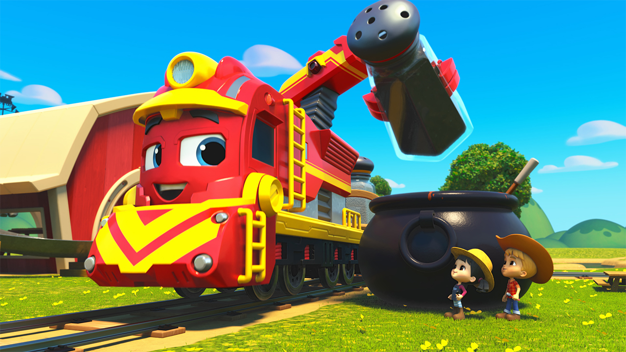 Still from Mighty Express showing a train engine sprinkling something into a big cauldron