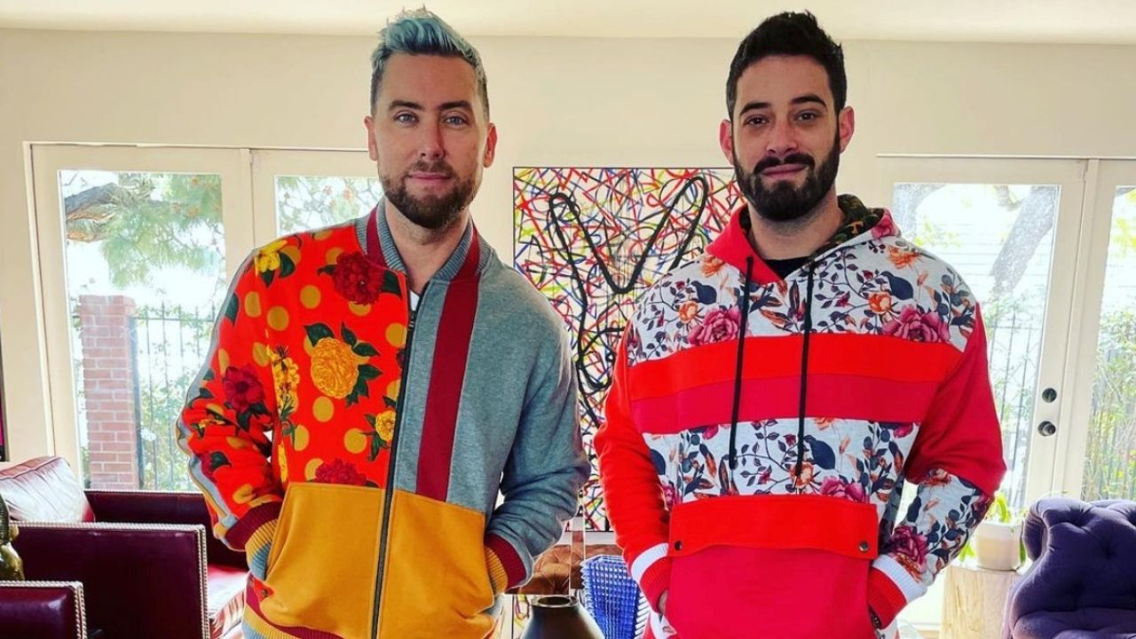 Lance Bass and his husband in vibrant sweatsuits