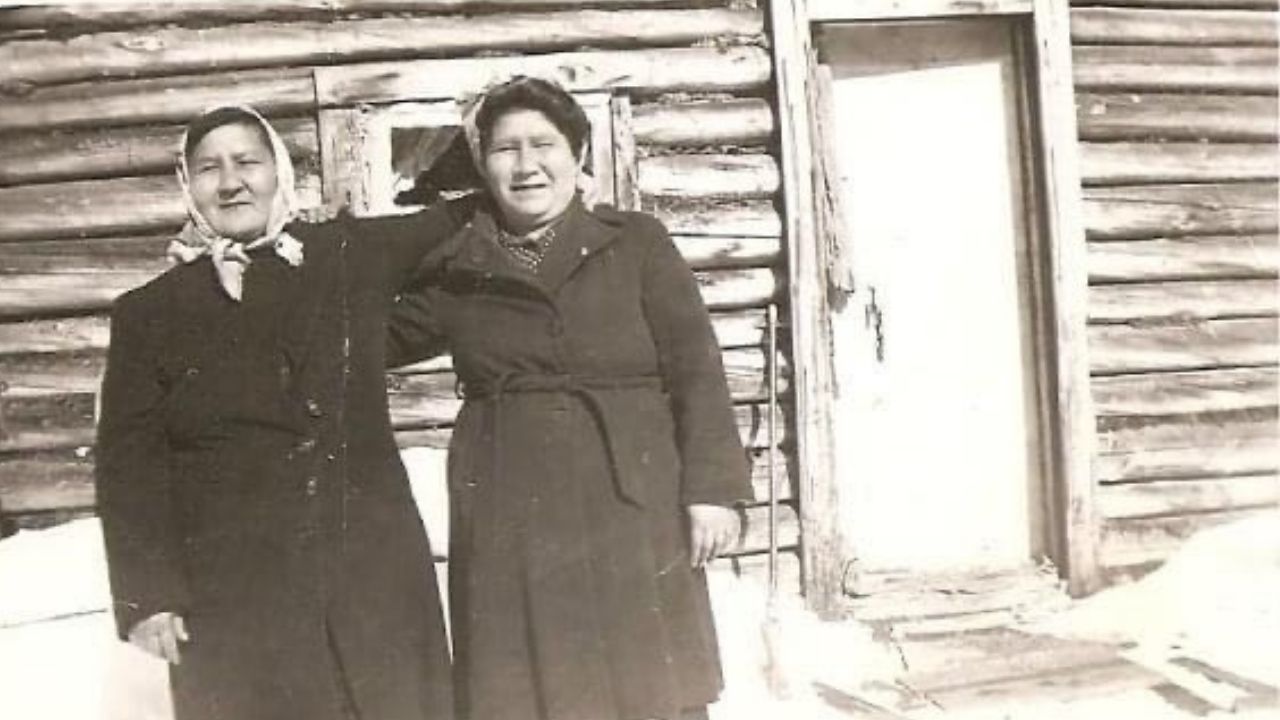 two women with their arms over each other's shoulders