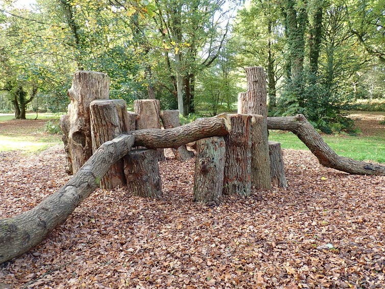 A natural playground built of logs.